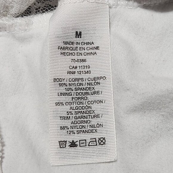 Coquette short-sleeved white lace crop top with a sheer back - Picture 6 of 13